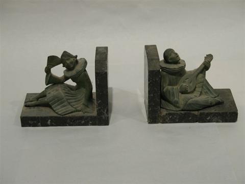 Appraisal: PAIR OF PATINATED METAL CLOWN BOOKENDS On green marble base