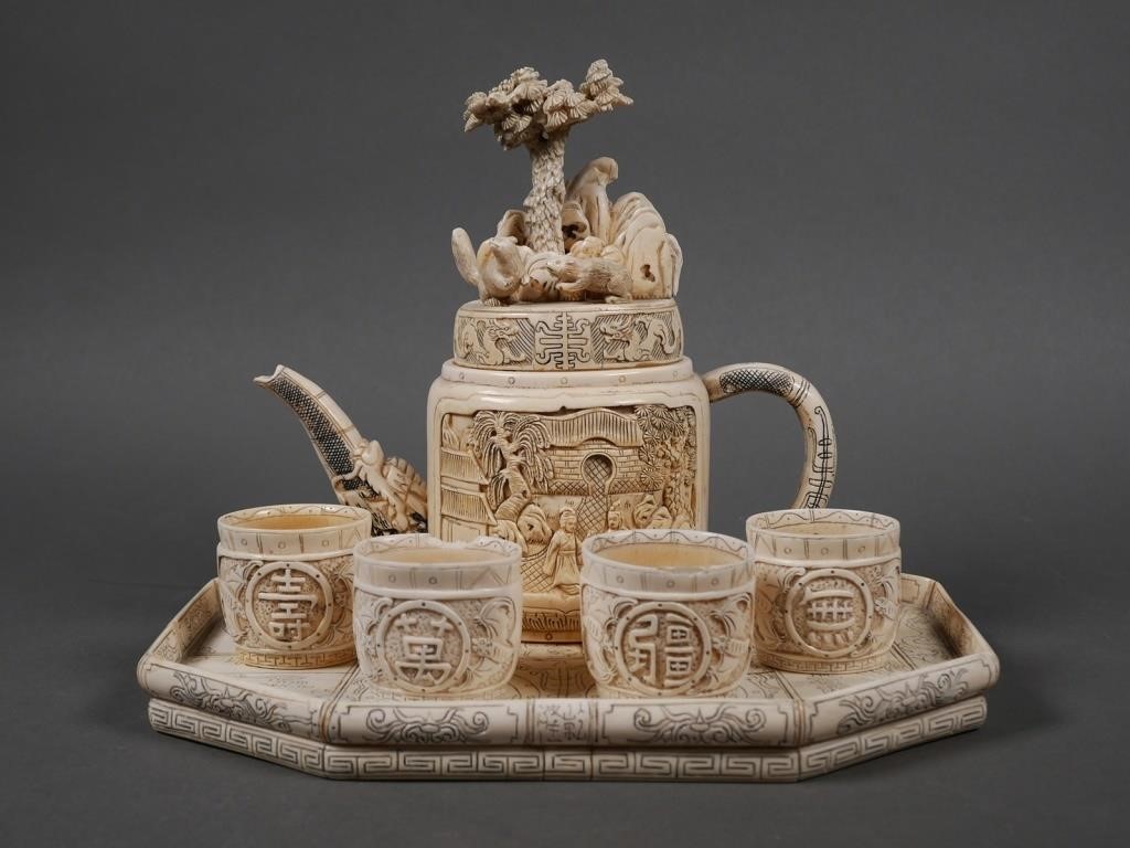 Appraisal: Antique Chinese carved ivory set includes Teapot with dragon head