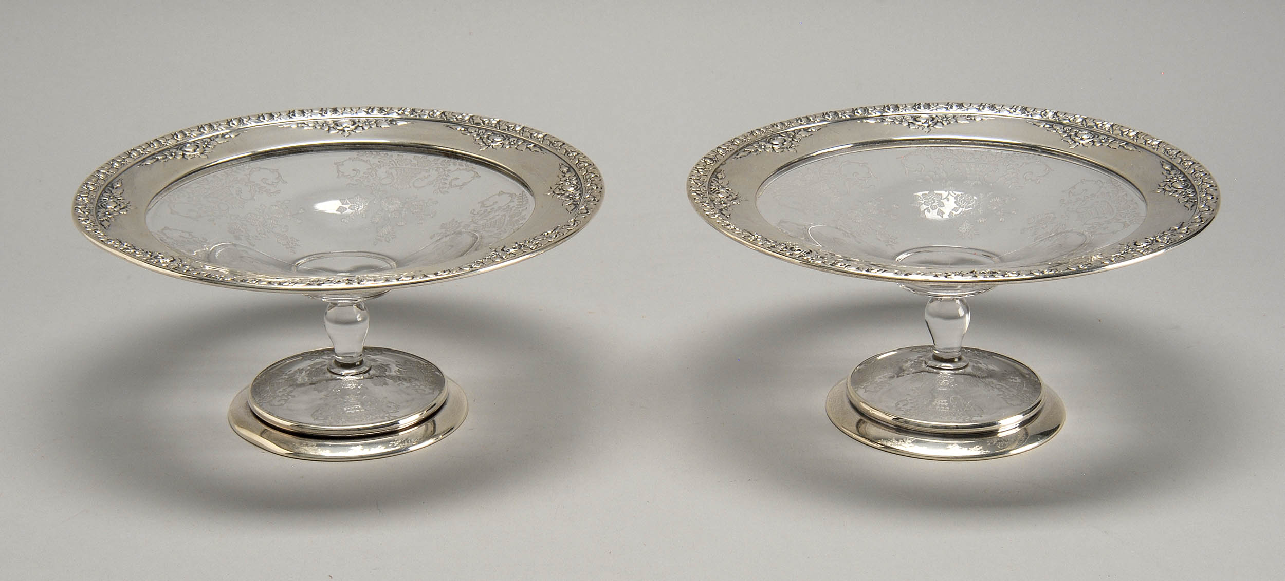 Appraisal: PAIR OF FOSTORIA GLASS TAZZE with sterling silver mounts at