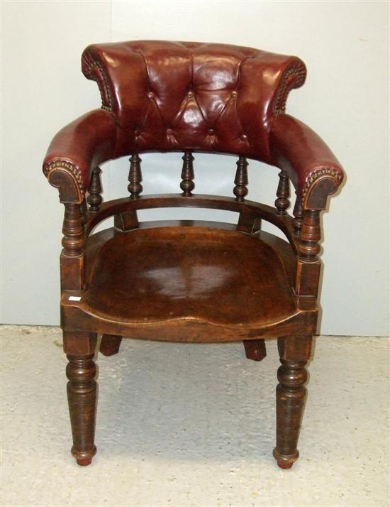 Appraisal: Victorian mahogany and leather button back desk chair on turned