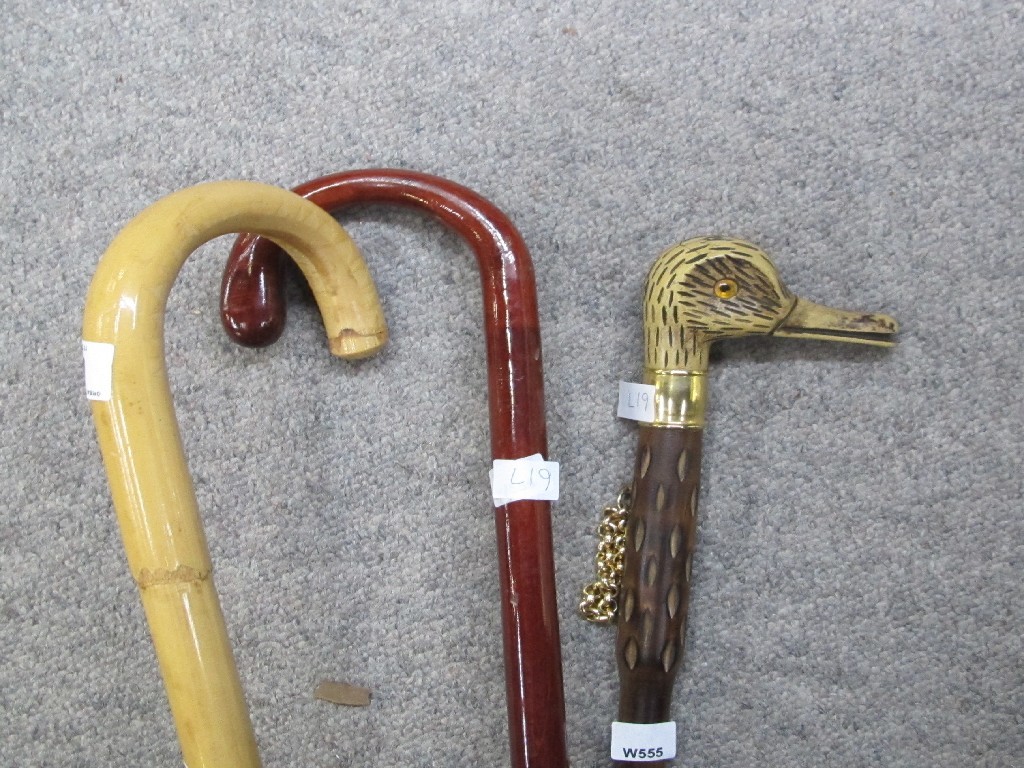 Appraisal: Lot comprising shoehorn and two walking sticks