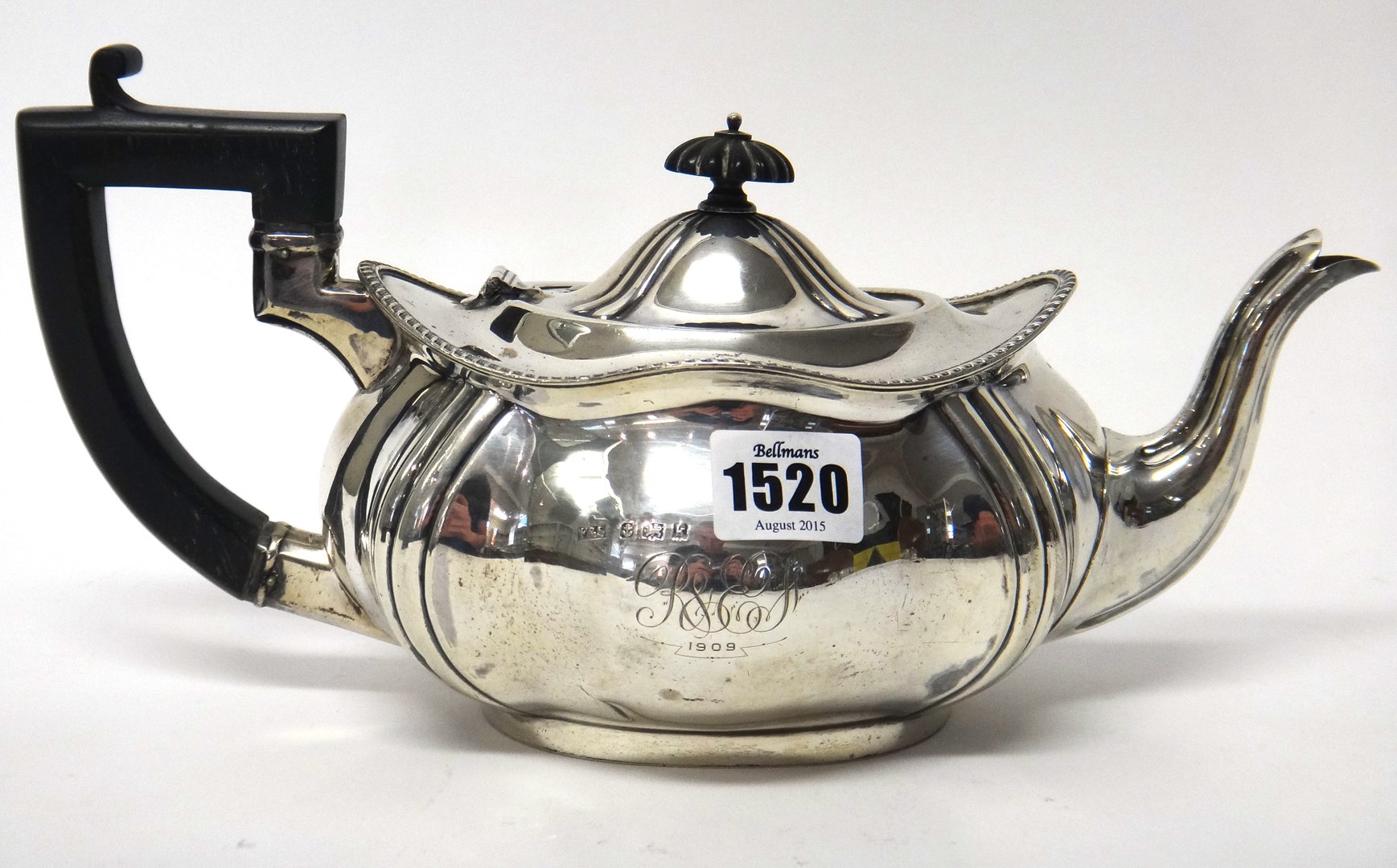 Appraisal: A silver teapot of shaped oval form with a gadrooned