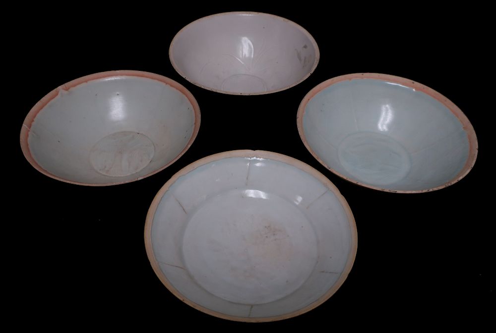 Appraisal: Four Qingbai Bowls Very thinly potted and molded bowls with