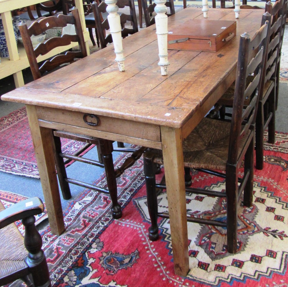 Appraisal: An early th century French cherrywood table the plank top