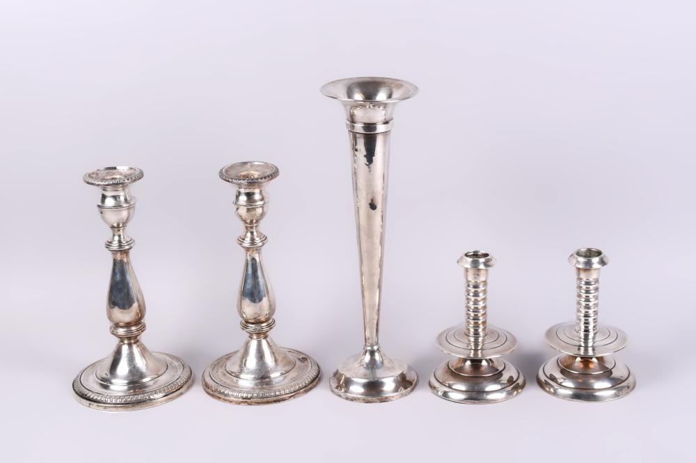 Appraisal: GROUP OF WEIGHTED CANDLESTICKS AND SILVER FLOWER VASE pair of