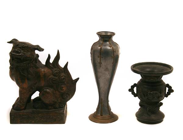 Appraisal: A group of Japanese cast metal decorations including a vase