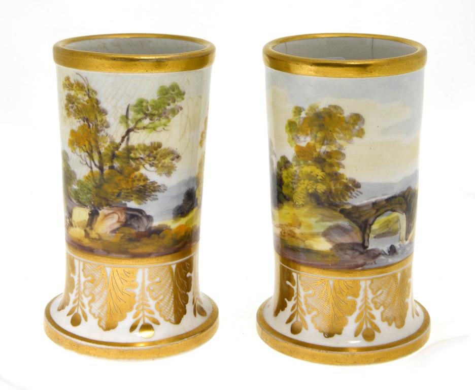 Appraisal: A PAIR OF STAFFORDSHIRE SPILL VASES painted with continuous landscapes