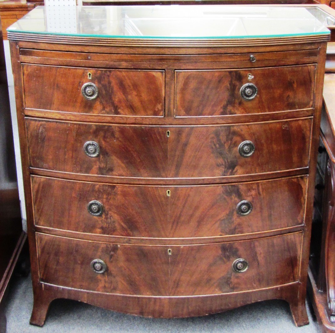 Appraisal: A George III style mahogany bowfront chest of two short