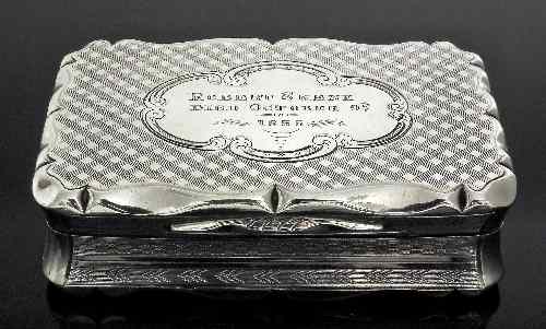 Appraisal: A Victorian silver rectangular snuff box of shaped outline with