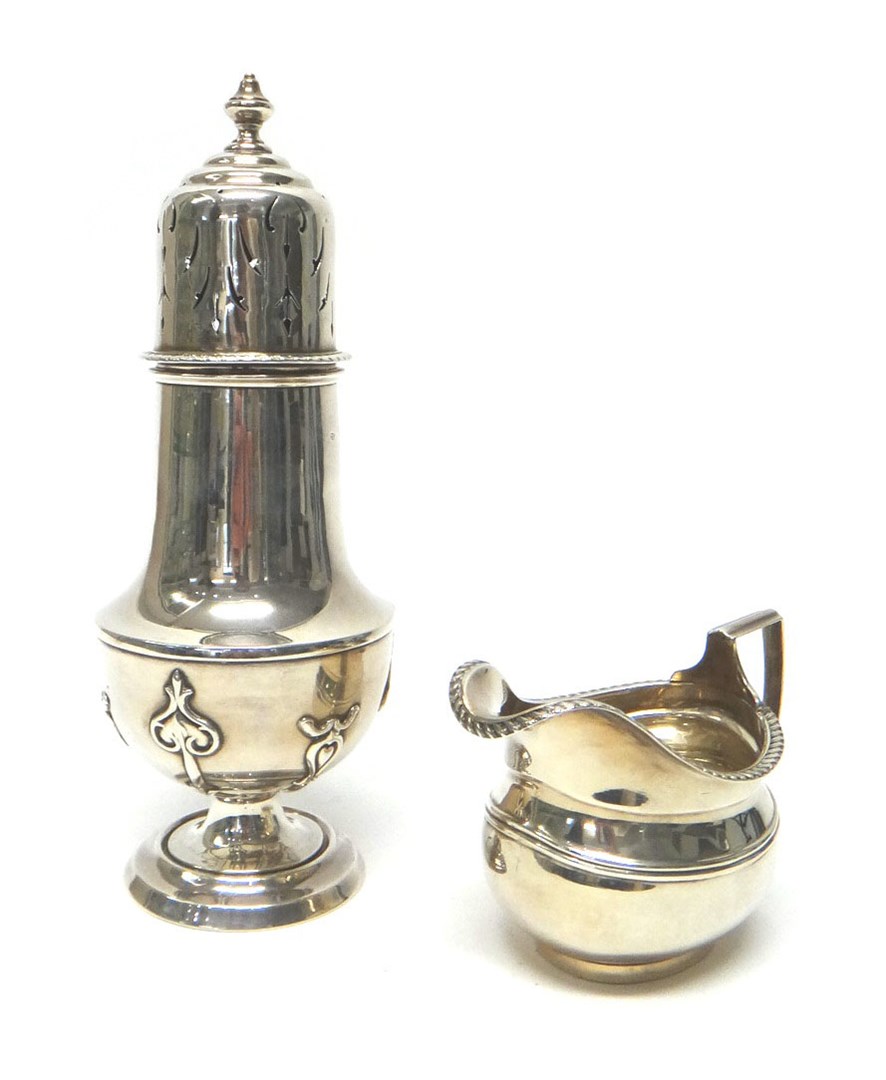 Appraisal: A silver baluster shaped sugar caster on a circular foot