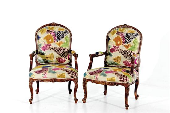 Appraisal: French style silk batik-upholstered armchairs bead-and-channel frame with cartouche-form back