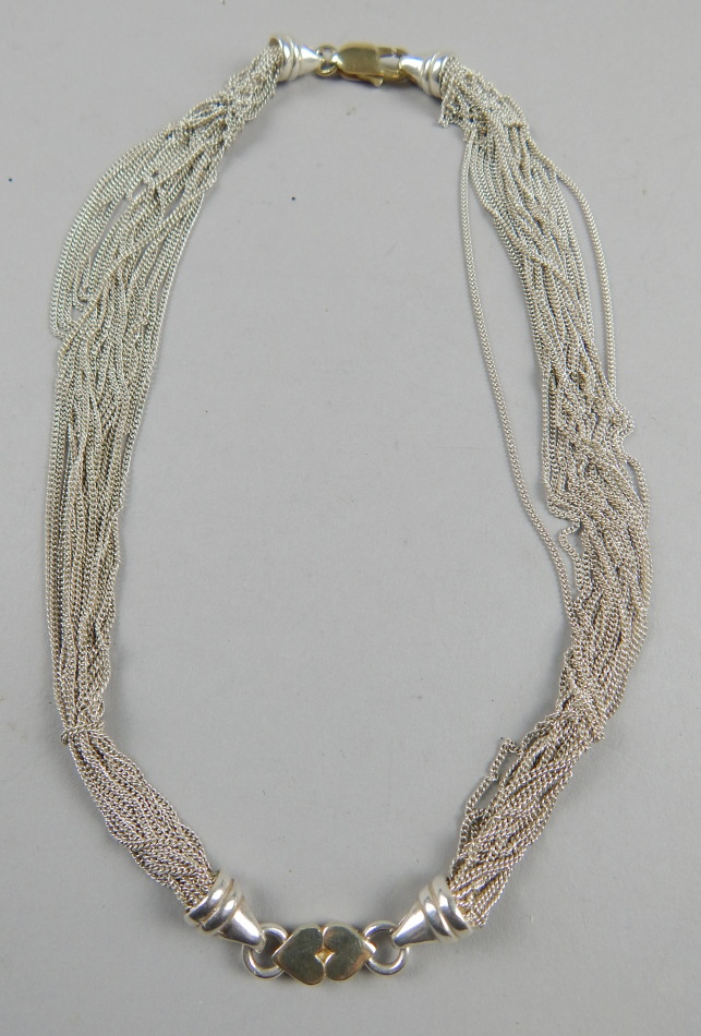 Appraisal: A modern silver necklace with various fine link chain design