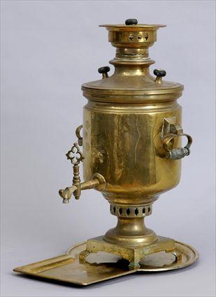 Appraisal: RUSSIAN BRASS SAMOVAR AND TRAY The cylindrical bowl with dated