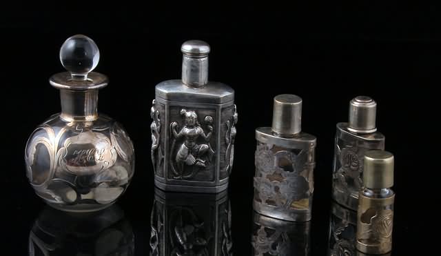 Appraisal: Circa four Continental bottles with silver overlay and Thai silver