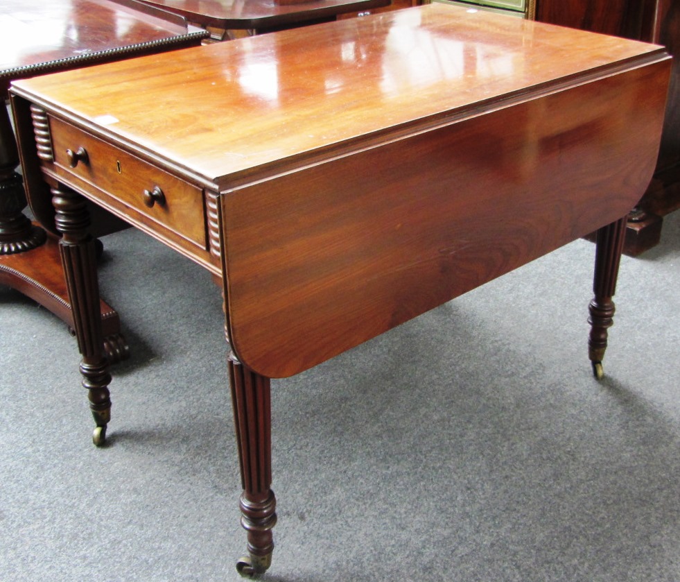 Appraisal: A th century mahogany pembroke table with single frieze drawer