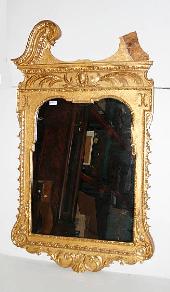 Appraisal: A George III style carved giltwood mirror