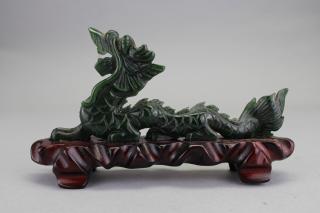 Appraisal: Chinese Carved Stone Dragon on Wooden Stand Chinese Carved Stone