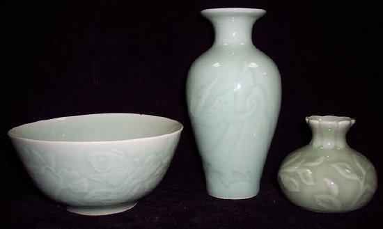 Appraisal: A Celadon glazed bowl decorated fish and lilies cm diameter