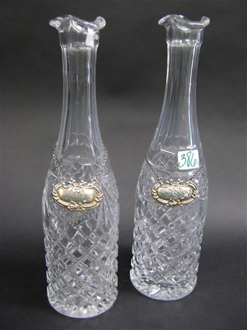 Appraisal: PAIR OF CUT CRYSTAL TALL DECANTERS with Sterling Silver tags