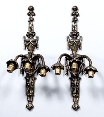 Appraisal: Pair bronze sconces each with three arms above figurehead with