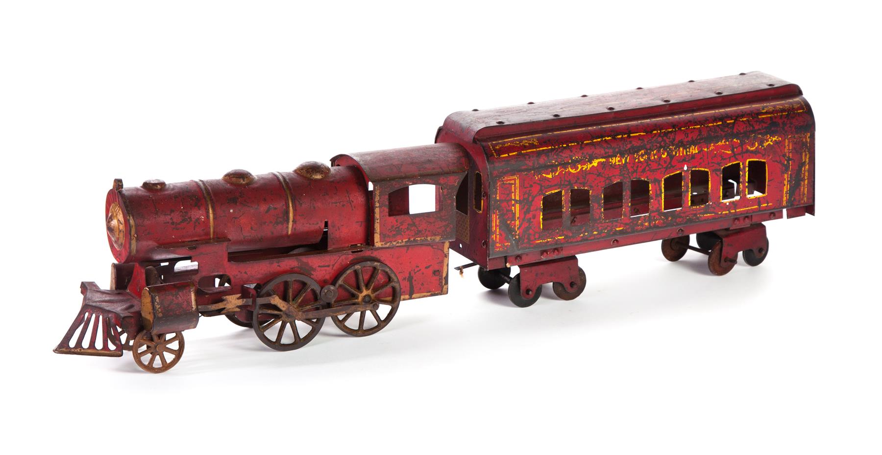 Appraisal: TWO-PIECE CHILD'S STEAM RAILROAD CONSIST American th century Tin frame