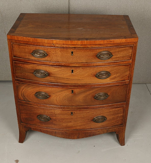 Appraisal: A GEORGE III MAHOGANY SMALL BOW FRONT CHEST of four