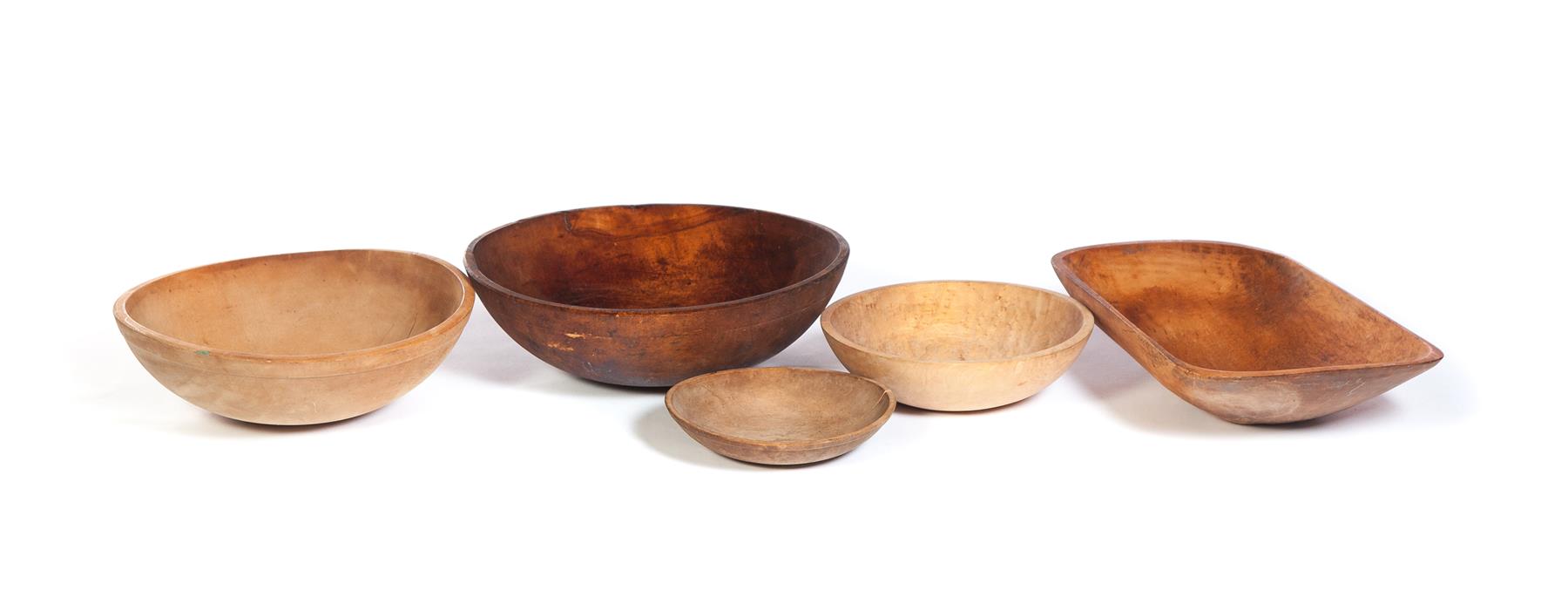 Appraisal: FOUR WOODEN BOWLS AND A TRENCHER American late th early