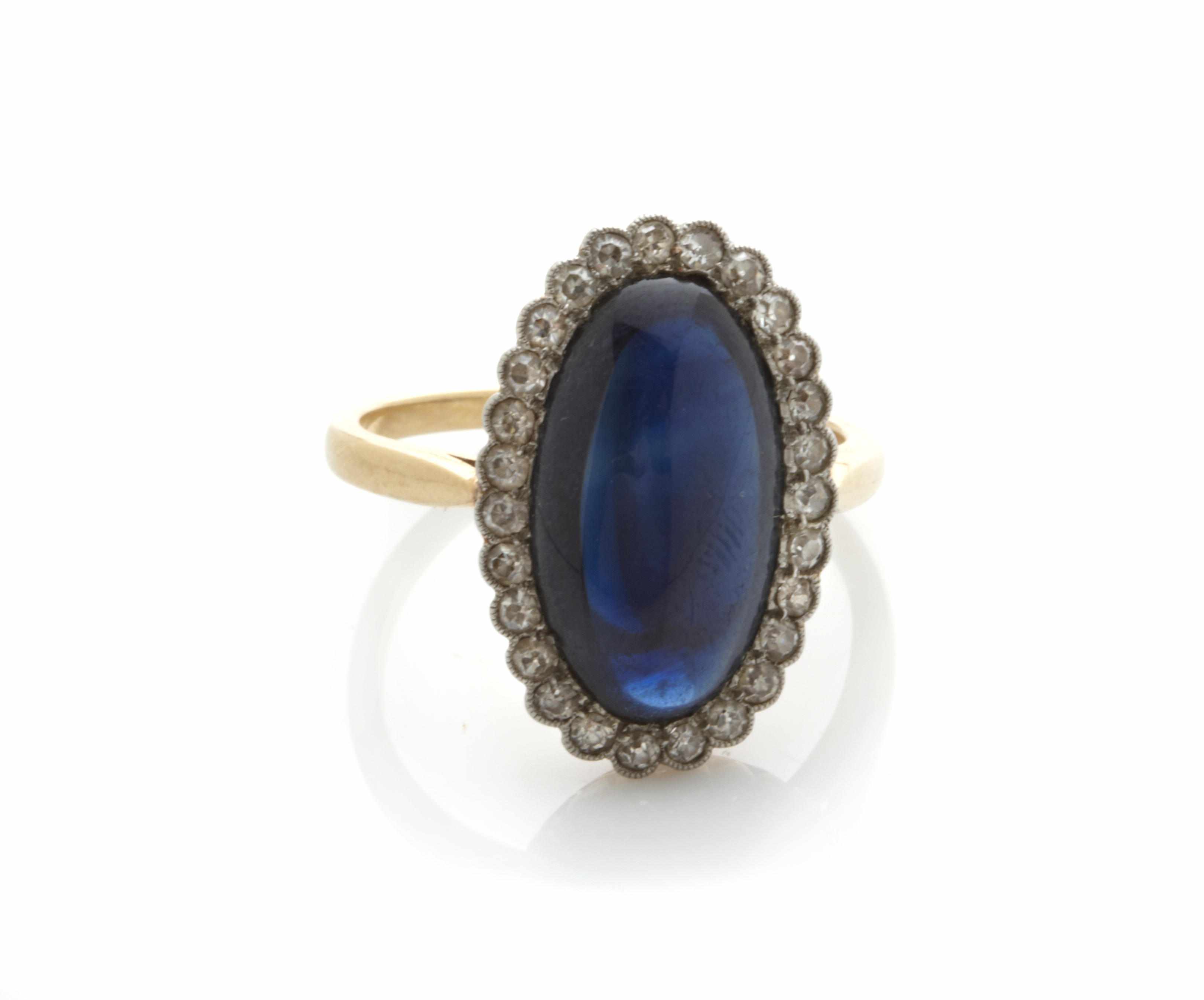 Appraisal: A sapphire cabochon diamond and bicolor gold ring size