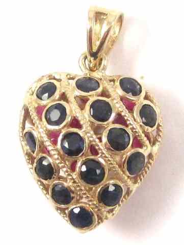 Appraisal: RUBY AND SAPPHIRE HEART PENDANT k yellow gol One side