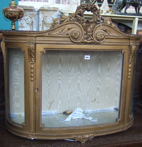 Appraisal: A th century gilt framed bow front display cabinet the