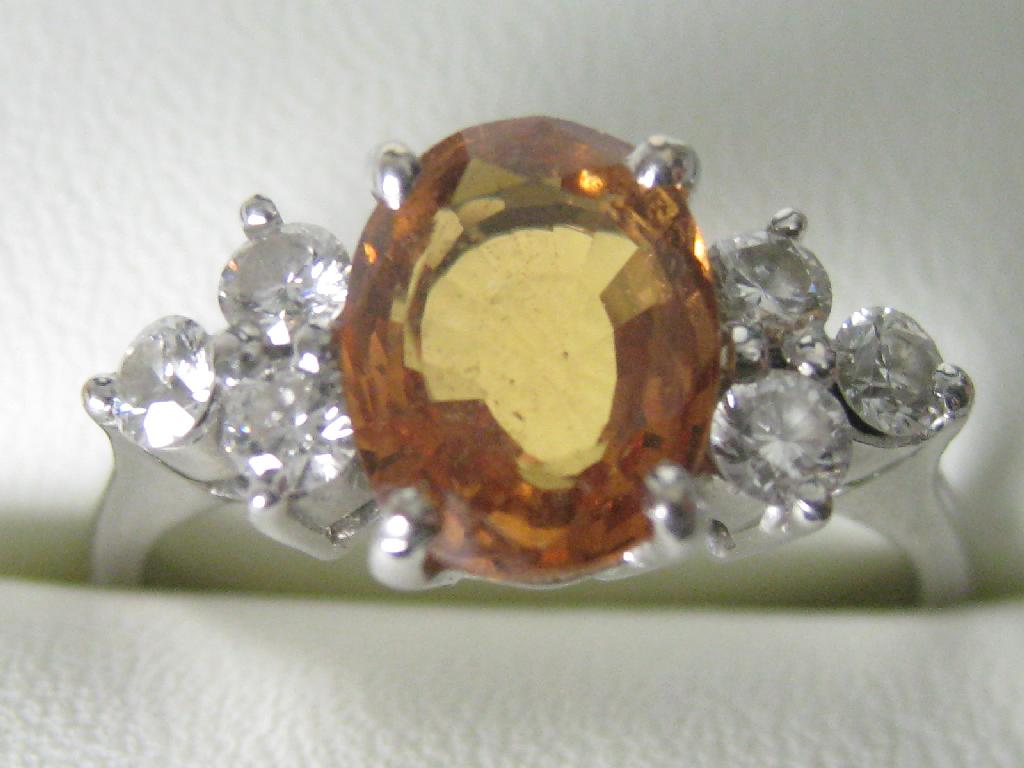 Appraisal: A Contemporary yellow Sapphire and Diamond Ring with oval shaped