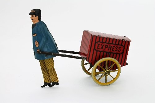 Appraisal: A Lehmann clockwork horseless carriage the pulling figure wearing a