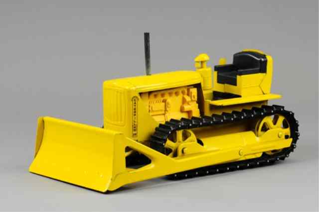 Appraisal: DOPEKE BULLDOZER Pressed steel painted in yellow overall great detail