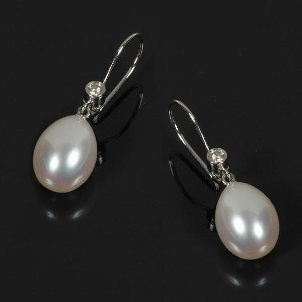 Appraisal: A pair of freshwater pearl diamond and white gold earrings