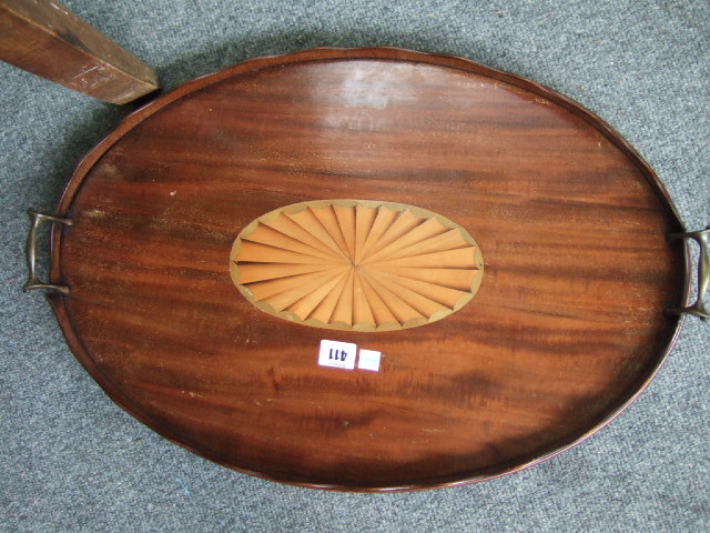 Appraisal: A th century mahogany serving tray with wavy gallery and