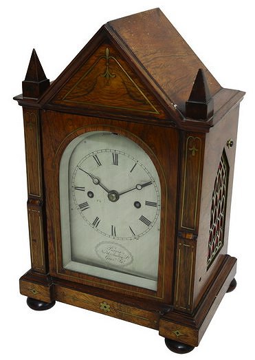 Appraisal: A th Century mantel clock in an arch top rosewood