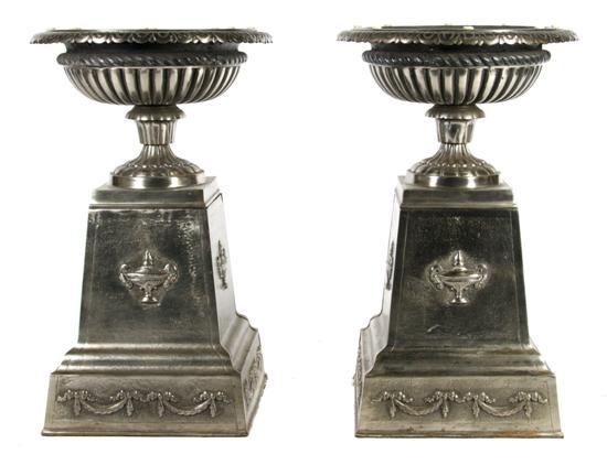 Appraisal: Pair of French Steel Pedestals and Urns having lobed rims