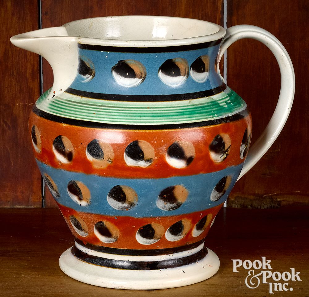 Appraisal: Mocha pitcher Mocha pitcher with four bands and cat's-eye decoration