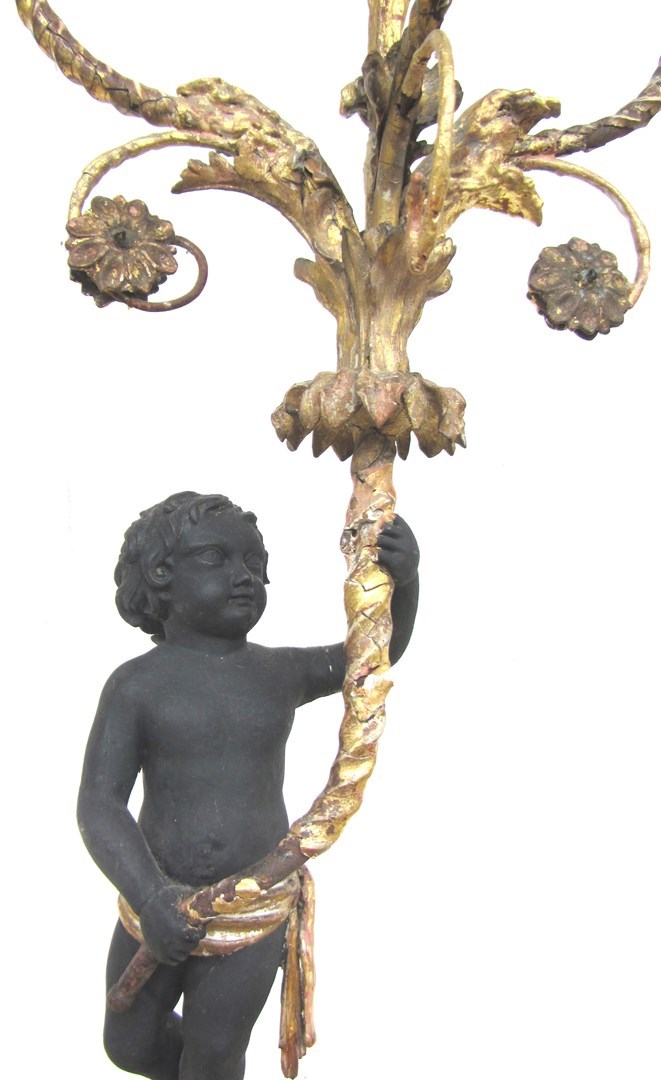 Appraisal: A pair of giltwood gesso and metal mounted figural candelabra