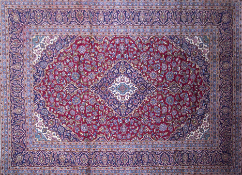 Appraisal: PERSIAN KASHAN Room-size rug with cobalt ivory and crimson central