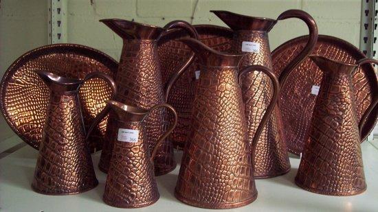 Appraisal: Six graduated copper jugs with crocodile skin embossed J S