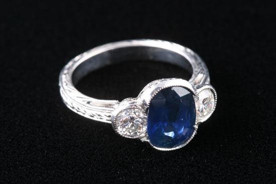 Appraisal: PLATINUM SAPPHIRE AND DIAMOND RING Centered with oval blue sapphire