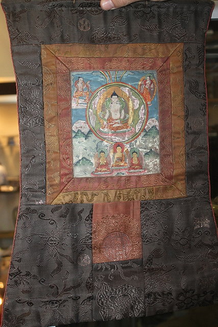 Appraisal: A TIBETAN SMALL THANKA with astral buddha th Century text