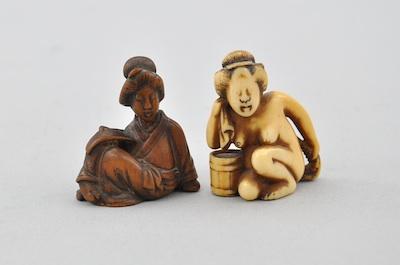 Appraisal: Two Netsukes of Women Ivory and wood carved females one