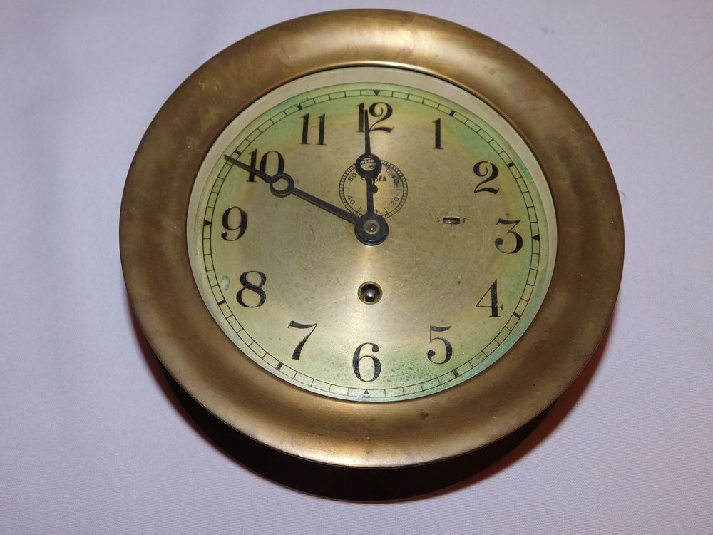 Appraisal: CHELSEA SHIPS CLOCK Old Chelsea brass ship's wall clock with