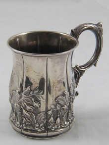 Appraisal: A Victorian silver mug of panelled bellied form with embossed