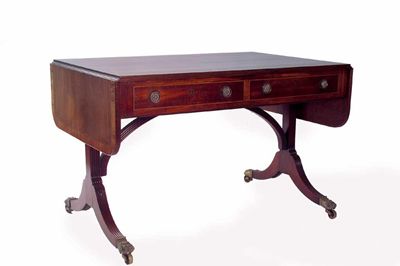 Appraisal: A Regency mahogany sofa table the satinwood crossbanded top with