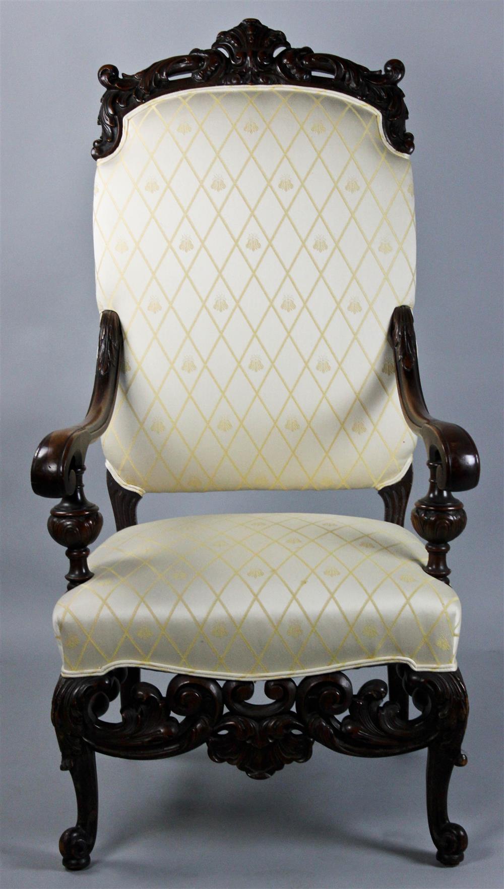 Appraisal: ROCOCO STYLE CARVED AND UPHOLSTERED ARM CHAIR pierced and carved