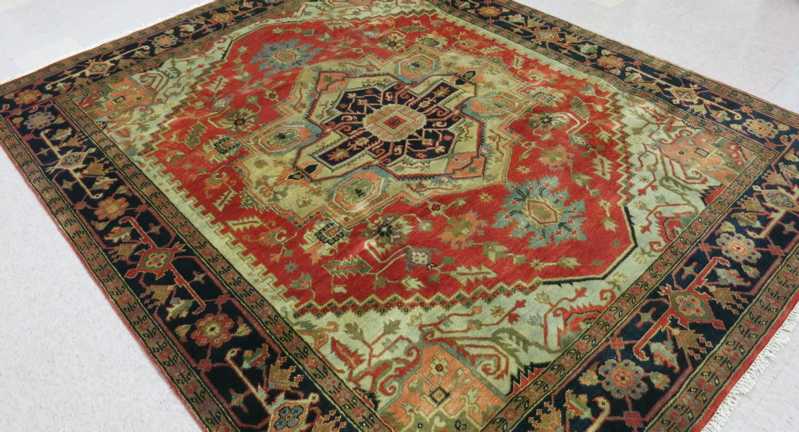 Appraisal: HAND KNOTTED ORIENTAL CARPET Indo-Heriz central geometric medallion and surrounding