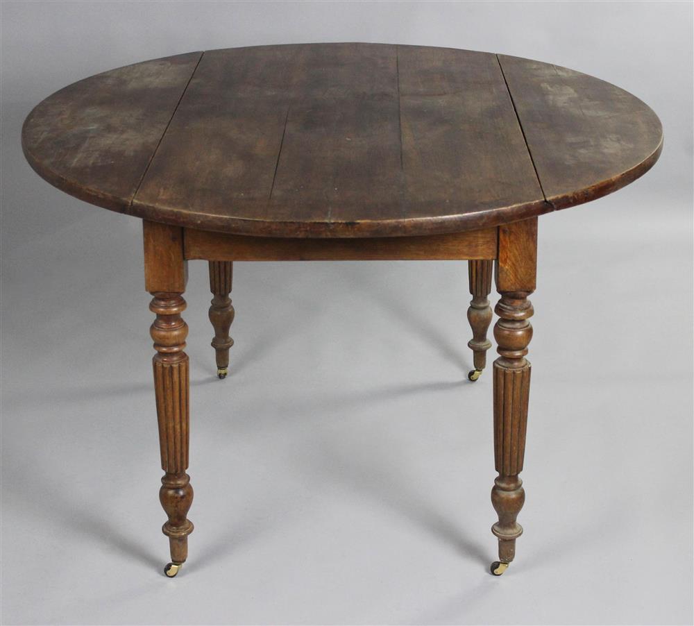 Appraisal: OVAL OAK DROP LEAF TABLE having a round top with